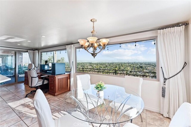 dining room with light tile patterned floors and a notable chandelier