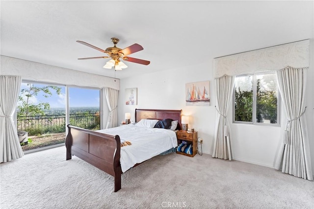 bedroom featuring ceiling fan, carpet flooring, and access to outside