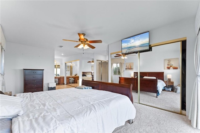 bedroom featuring ceiling fan and light carpet