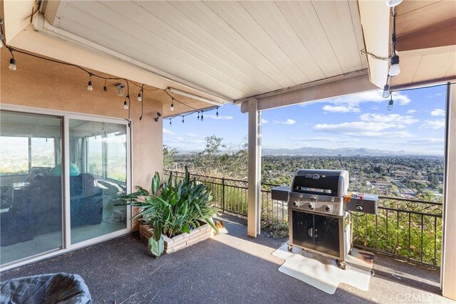 sunroom / solarium featuring a mountain view