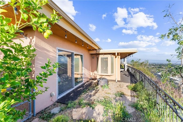 view of property exterior with a patio area