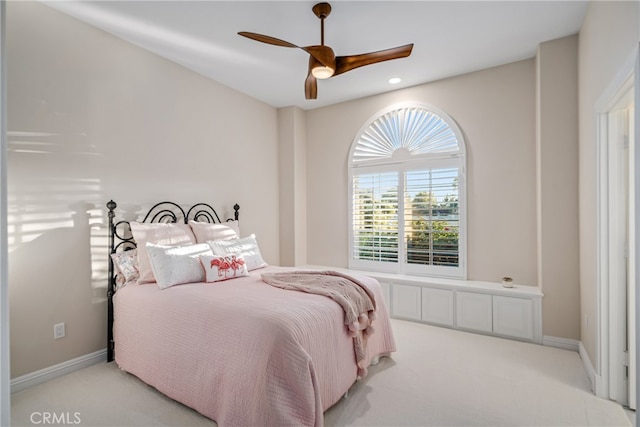 bedroom with light colored carpet and ceiling fan