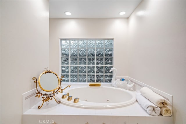 bathroom featuring tiled tub