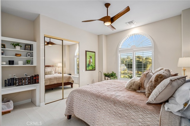 bedroom with a closet and ceiling fan