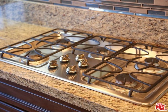 details featuring stainless steel gas cooktop