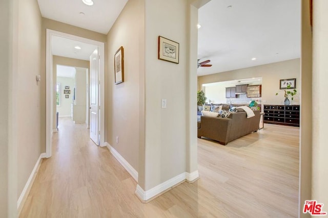 corridor featuring light hardwood / wood-style floors