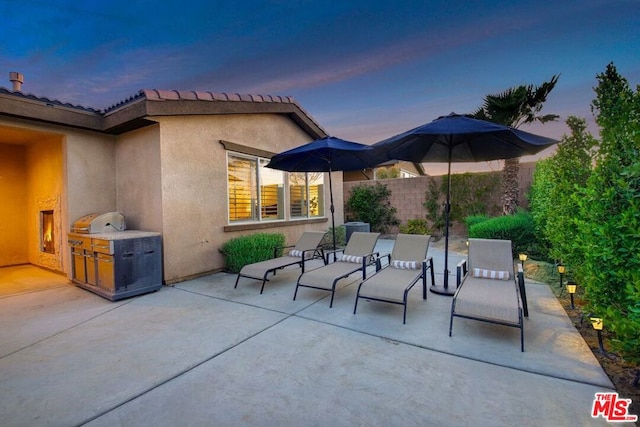 view of patio terrace at dusk