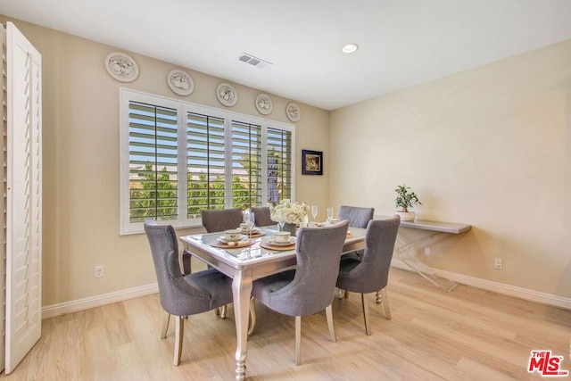 dining space featuring light hardwood / wood-style floors