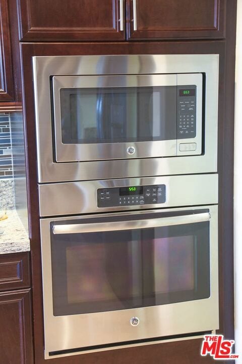 room details featuring appliances with stainless steel finishes