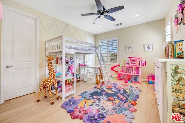 playroom with ceiling fan and light wood-type flooring