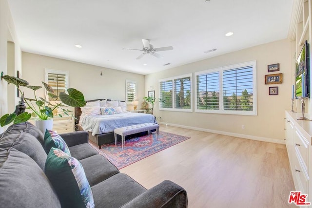 bedroom featuring light hardwood / wood-style flooring and ceiling fan