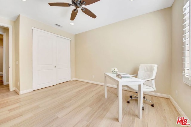 office area featuring light hardwood / wood-style flooring and ceiling fan