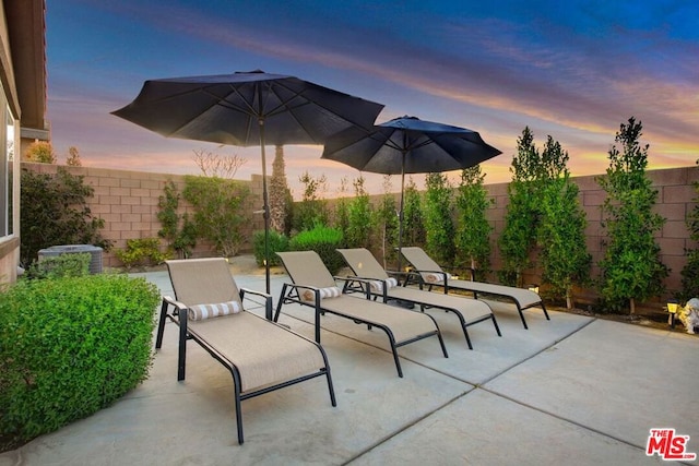 view of patio terrace at dusk