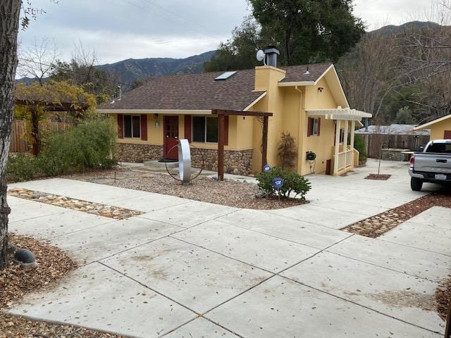 ranch-style house with a mountain view