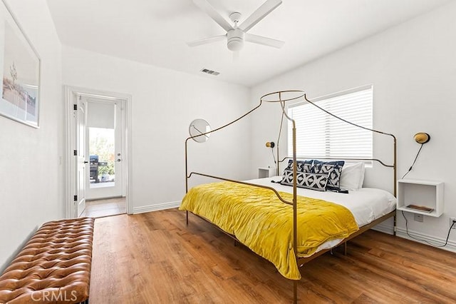 bedroom featuring ceiling fan and hardwood / wood-style floors