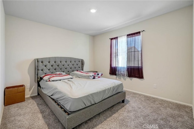 bedroom featuring light colored carpet