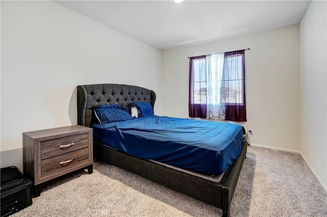 bedroom featuring light colored carpet