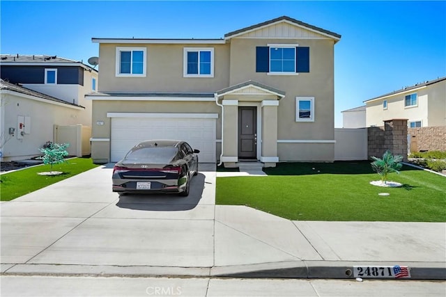 view of front property with a front lawn and a garage