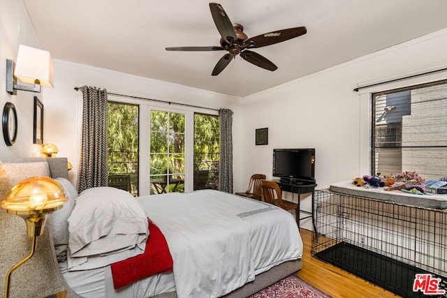 bedroom with ceiling fan, light hardwood / wood-style floors, and ornamental molding