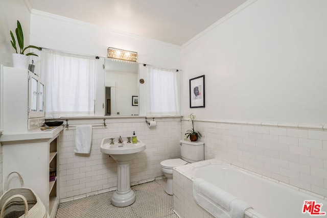 bathroom featuring tile walls, plenty of natural light, tile floors, and a bathtub