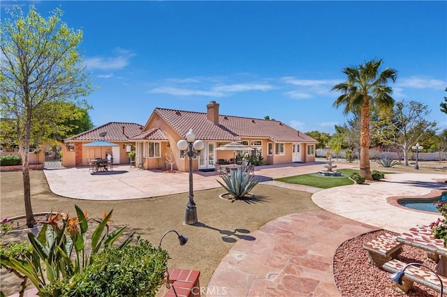 back of house with a patio