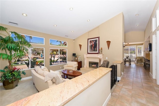 tiled living room featuring high vaulted ceiling