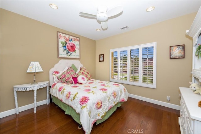 bedroom with ceiling fan and dark hardwood / wood-style floors