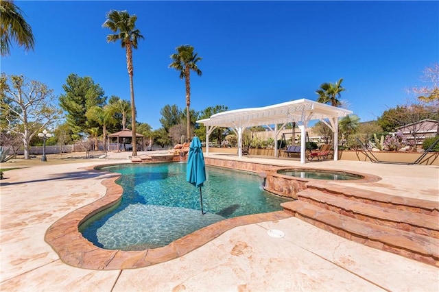 view of pool with an in ground hot tub, a gazebo, and a patio