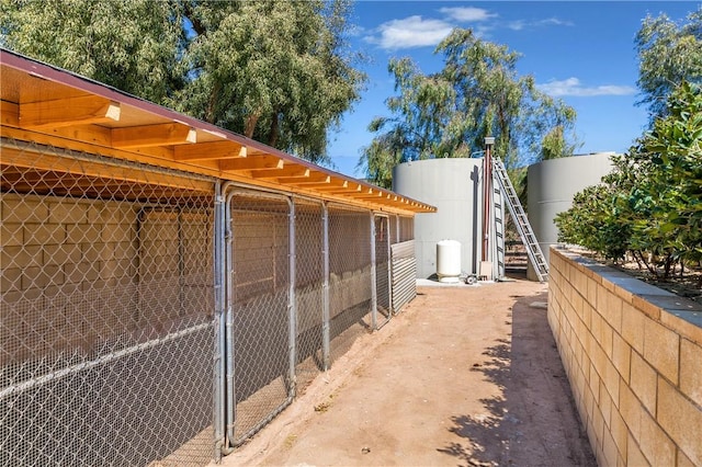 view of side of home featuring an outbuilding