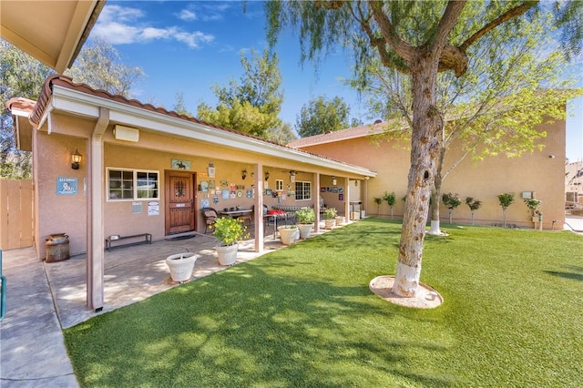 view of front of property with a front lawn and a patio