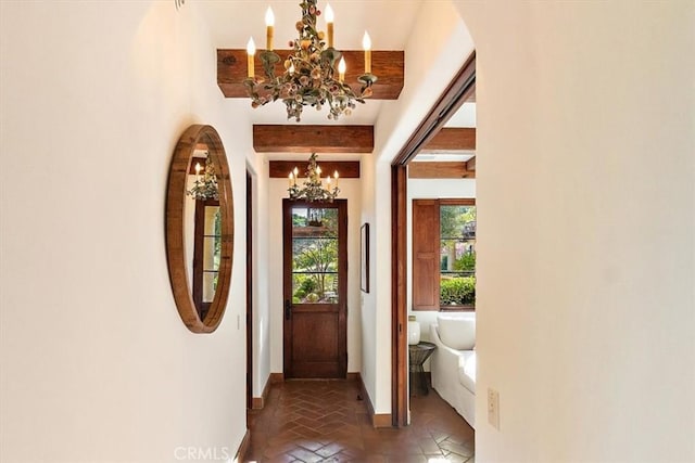 entryway featuring a notable chandelier