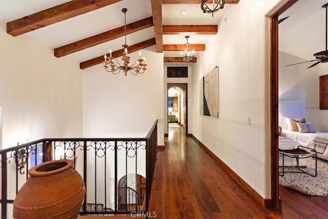 hallway with dark hardwood / wood-style flooring, beamed ceiling, high vaulted ceiling, and an inviting chandelier