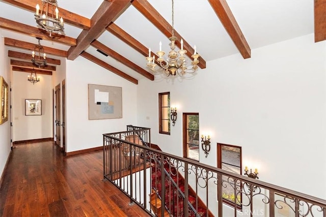 hall with beam ceiling, high vaulted ceiling, dark hardwood / wood-style floors, and an inviting chandelier