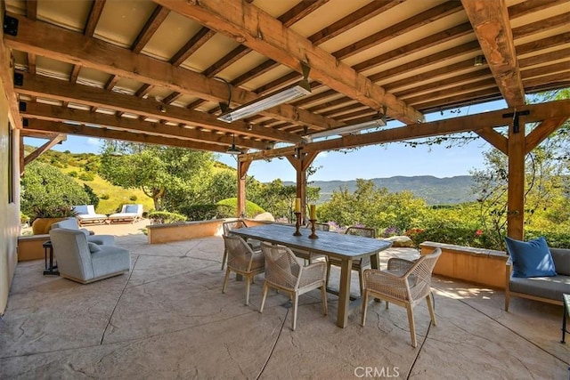 view of patio / terrace featuring outdoor lounge area and a mountain view