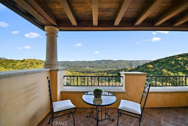 balcony featuring a mountain view