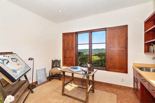 2835 Hermitage Rd, Ojai, CA 93023 - office with baseboards, a sink, and stone finish floor