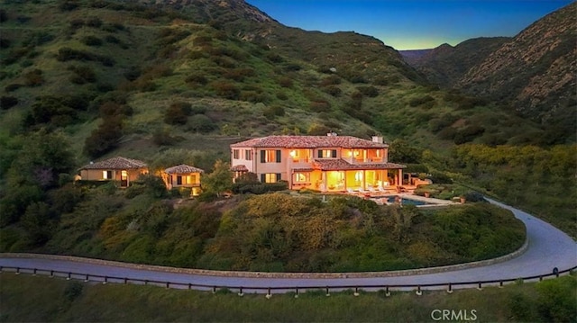 2835 Hermitage Rd, Ojai, CA 93023 - rear view of property with stucco siding, a mountain view, and a chimney