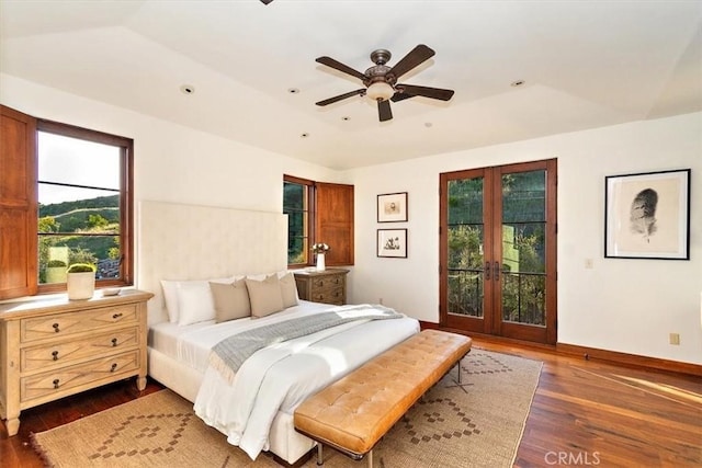 bedroom with dark hardwood / wood-style floors, ceiling fan, access to exterior, and french doors