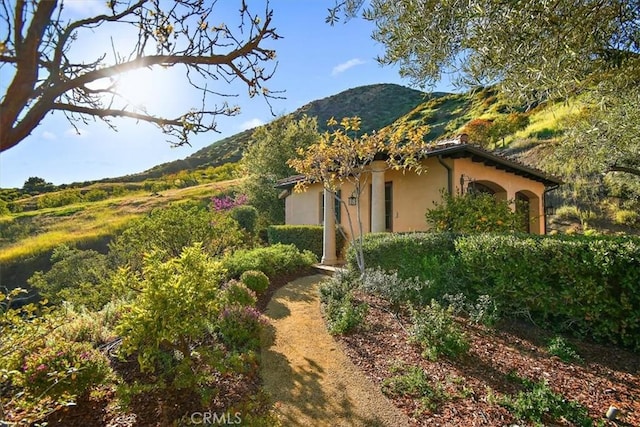 view of home's exterior featuring a mountain view