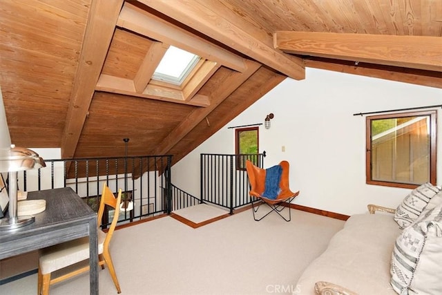 interior space with lofted ceiling with skylight, carpet floors, and wood ceiling