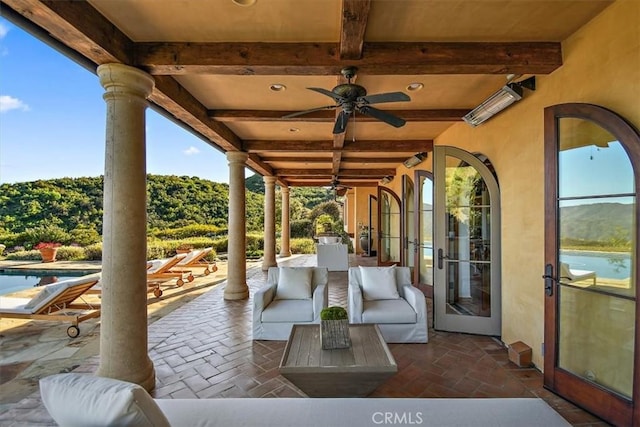 view of patio with french doors, an outdoor hangout area, and ceiling fan