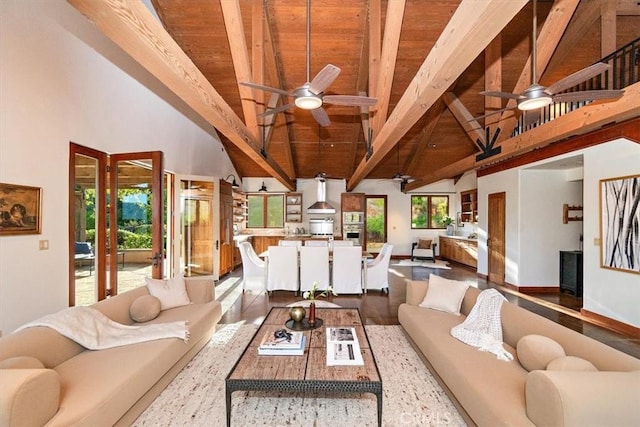 living room with beamed ceiling, wooden ceiling, and a healthy amount of sunlight