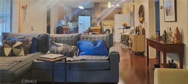 interior space with wood-type flooring and washer / dryer