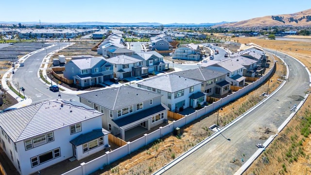 birds eye view of property featuring a mountain view