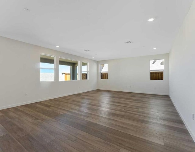 empty room with dark wood-type flooring