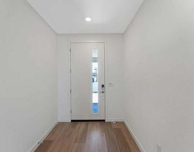 doorway to outside with light wood-type flooring