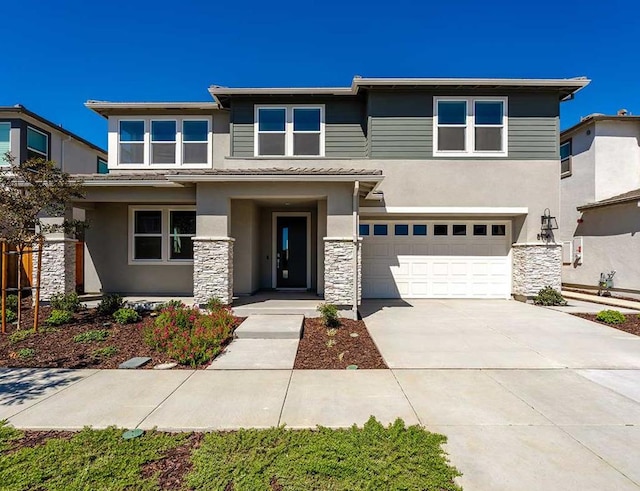 prairie-style home featuring a garage