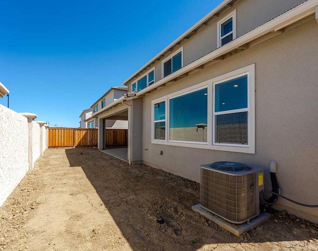 view of side of property featuring cooling unit