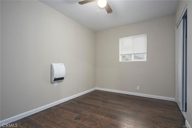 6454 Goleta Ave, Yucca Valley, CA 92284 - unfurnished bedroom with dark wood finished floors, baseboards, a closet, and ceiling fan