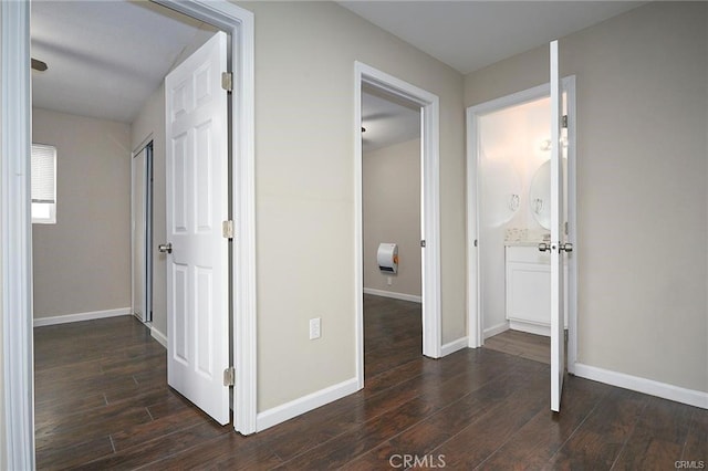 corridor with dark hardwood / wood-style floors